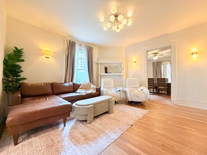 Bright living room with original fireplace and comfortable seating